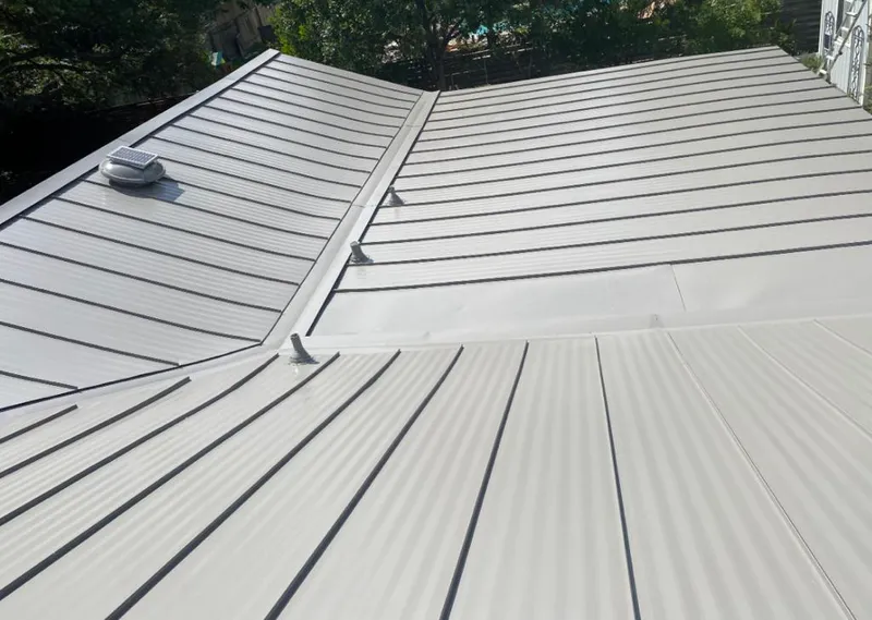 Solar attic fan installed on a metal roof for Roof Ventilation in Palmetto
